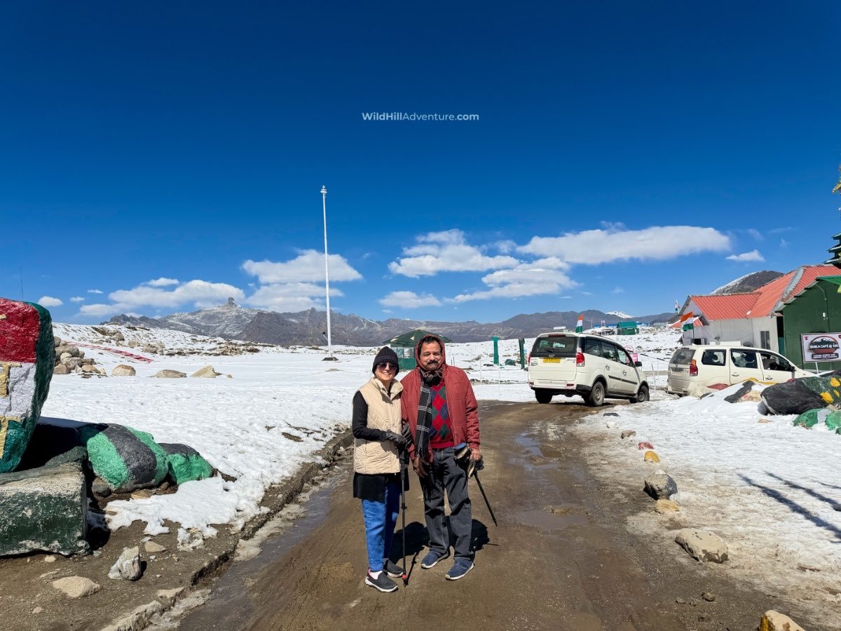 Wild Hill Adventure Senior travellers enjoying a snowy mountain destination in Arunachal Pradesh during the Tawang winter senior citizen tour package with Wild Hill Adventure.